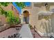 Inviting front entrance with well-manicured landscaping and a charming walkway to the front door at 9012 Old River Ave, Las Vegas, NV 89149