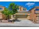 Beautiful two-story home with a well-kept lawn, attached garage, and inviting curb appeal at 9012 Old River Ave, Las Vegas, NV 89149