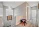 Hallway with table and chairs and view into the bedrooms at 9012 Old River Ave, Las Vegas, NV 89149