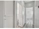 Hallway with built-in cabinets and a view into a bedroom with natural light at 9012 Old River Ave, Las Vegas, NV 89149
