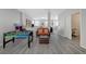 Spacious living room with sleek flooring, neutral colors, and an open layout perfect for entertaining at 9012 Old River Ave, Las Vegas, NV 89149