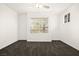 Cozy bedroom featuring a large window and neutral paint at 913 Duckhorn Ct # 204, Las Vegas, NV 89144