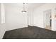 Spacious living room with new carpet, light fixture, and neutral walls at 913 Duckhorn Ct # 204, Las Vegas, NV 89144