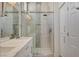 Modern bathroom featuring a glass shower door, marble countertops, and stylish tile accents at 10100 Folsom Dr, Las Vegas, NV 89134