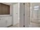 Well-lit bathroom showcasing a vanity with marble countertop, and a shower-tub combo at 10100 Folsom Dr, Las Vegas, NV 89134