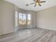 Bedroom showcasing a corner bay window, ceiling fan, and neutral paint, ready for personalization at 10100 Folsom Dr, Las Vegas, NV 89134