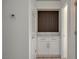 Hallway featuring a built-in wet bar with stone countertop and cabinet at 10100 Folsom Dr, Las Vegas, NV 89134