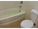 Clean, well-maintained bathroom with a soaking tub and commode at 10371 Calypso Cave St, Las Vegas, NV 89141