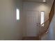 Bright entryway featuring a staircase with wooden handrail and a decorative window at 10371 Calypso Cave St, Las Vegas, NV 89141