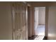 Hallway with closet leading to a bedroom with soft carpeting at 10371 Calypso Cave St, Las Vegas, NV 89141