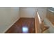 Hallway features hardwood floors and a staircase with wooden railing at 10371 Calypso Cave St, Las Vegas, NV 89141