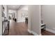 Open hallway featuring wood floors, neutral walls, and elegant décor, enhancing the home's modern aesthetic at 12310 Tudor Arch Dr, Las Vegas, NV 89138