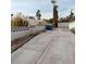 Long driveway leading to a detached garage in the backyard at 1413 Bryn Mawr Ave, Las Vegas, NV 89102