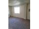 A small bedroom space features natural light from a single window at 1413 Bryn Mawr Ave, Las Vegas, NV 89102