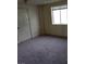 A bright bedroom with neutral carpet and a window at 1413 Bryn Mawr Ave, Las Vegas, NV 89102