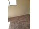 This bedroom features carpeted floors and a window at 1413 Bryn Mawr Ave, Las Vegas, NV 89102