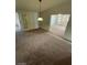 Open dining room with a pendant light and views to other rooms at 1413 Bryn Mawr Ave, Las Vegas, NV 89102
