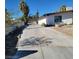 Long driveway with a gated entrance leading to the house and detached garage at 1413 Bryn Mawr Ave, Las Vegas, NV 89102