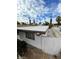 Exterior side view of the home with white paint, showing roof and window details at 1413 Bryn Mawr Ave, Las Vegas, NV 89102