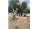 Large olive tree in the front yard of a charming home with a brick walkway at 1413 Bryn Mawr Ave, Las Vegas, NV 89102