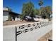 Home with a decorative concrete fence, mature landscaping, and a spacious front yard at 1413 Bryn Mawr Ave, Las Vegas, NV 89102