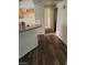 Kitchen with granite countertop, wood cabinets, and modern wood-look flooring at 1413 Bryn Mawr Ave, Las Vegas, NV 89102
