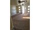 Open living room area showcasing the unique front door and natural light at 1413 Bryn Mawr Ave, Las Vegas, NV 89102