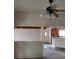 Bright living room featuring a ceiling fan and open floor plan leading to the kitchen at 1413 Bryn Mawr Ave, Las Vegas, NV 89102