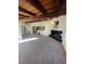 Inviting living room with a black fireplace and large window, offering a view of the exposed wood beam ceiling at 1413 Bryn Mawr Ave, Las Vegas, NV 89102