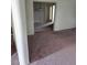 Spacious living room with neutral walls and carpets and views to other rooms at 1413 Bryn Mawr Ave, Las Vegas, NV 89102