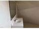 A bathroom featuring a bright vanity, mirror, and angled ceiling at 1427 San Felipe Dr, Boulder City, NV 89005