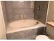 Bathroom features a large white soaking tub with tile surround at 1427 San Felipe Dr, Boulder City, NV 89005