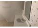 Bathroom featuring a white countertop, sink, medicine cabinet and wallpapered walls at 1427 San Felipe Dr, Boulder City, NV 89005