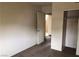 Bedroom with neutral walls, carpet, closet with sliding doors, and an open doorway at 1427 San Felipe Dr, Boulder City, NV 89005