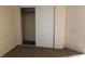 Bedroom with neutral carpeting, closet, and electrical outlets on the wall at 1427 San Felipe Dr, Boulder City, NV 89005