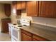Spacious kitchen featuring granite countertops and ample cabinet space at 1427 San Felipe Dr, Boulder City, NV 89005
