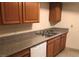 Features a kitchen with light wood cabinets and granite countertops at 1427 San Felipe Dr, Boulder City, NV 89005