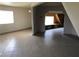 Bright living room with tile flooring, a large window, and a unique architectural feature at 1427 San Felipe Dr, Boulder City, NV 89005