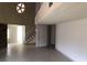 Open living space with tiled floors, stairs leading upstairs and a unique architectural design at 1427 San Felipe Dr, Boulder City, NV 89005