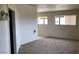 Living area with carpet flooring, natural light, and view into another room at 1427 San Felipe Dr, Boulder City, NV 89005