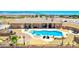 Aerial view of a home with a backyard oasis featuring a large pool, spa, and plenty of room for outdoor entertaining at 1440 Lost Creek Dr, Pahrump, NV 89048