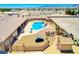 Aerial view of property featuring home, pool, spa, outdoor amenities and partially fenced backyard at 1440 Lost Creek Dr, Pahrump, NV 89048