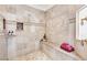 Custom shower features bench seat and decorative tile design at 1440 Lost Creek Dr, Pahrump, NV 89048