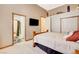 Bedroom features carpet, ensuite bath, TV and walk-in closet at 1440 Lost Creek Dr, Pahrump, NV 89048