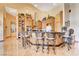 Open kitchen featuring a center island with bar seating, custom cabinetry, and tile floors at 1440 Lost Creek Dr, Pahrump, NV 89048
