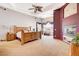 Spacious bedroom with carpet, ceiling fan, unique windows and fireplace at 1440 Lost Creek Dr, Pahrump, NV 89048