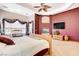 Spacious bedroom with carpet, ceiling fan, unique windows and fireplace at 1440 Lost Creek Dr, Pahrump, NV 89048