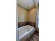 Corner bathtub with tile surround and window at 16 Via Visione # 102, Henderson, NV 89011