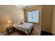 Cozy bedroom featuring a bedside table and soft natural light at 16 Via Visione # 102, Henderson, NV 89011