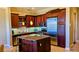 Gourmet kitchen featuring a large island, stainless steel appliances, and granite countertops at 16 Via Visione # 102, Henderson, NV 89011